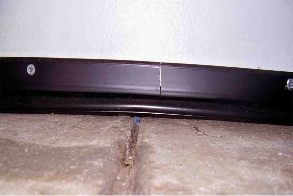 damaged garage door seal before replacement