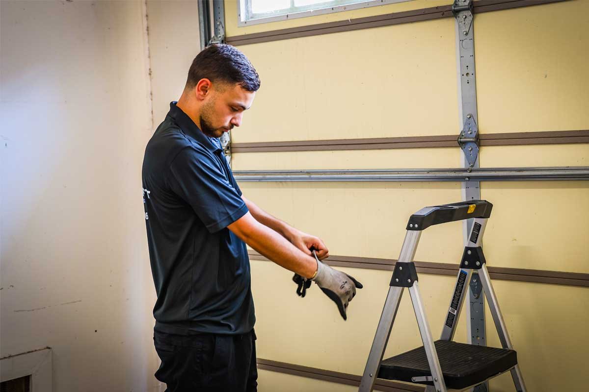 professional repairing modern garage door