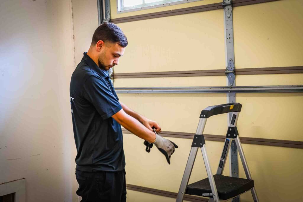 Man setting up LiftMaster garage door opener system