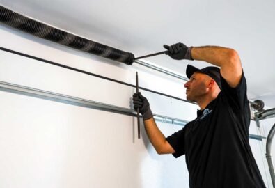 garage door sensor repair with technician and tools