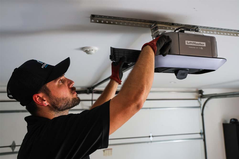 technician installing garage door springs in pasadena texas