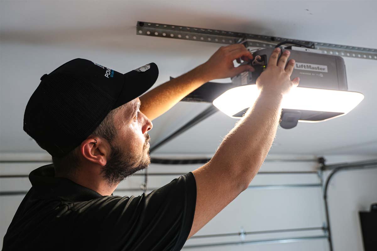 technician repairing liftmaster garage door opener in pearland tx