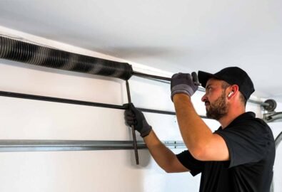 technician replacing bent garage door spring in pearland tx
