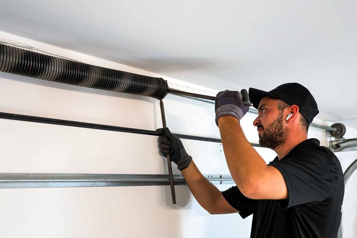 technician replacing bent garage door spring in pearland tx