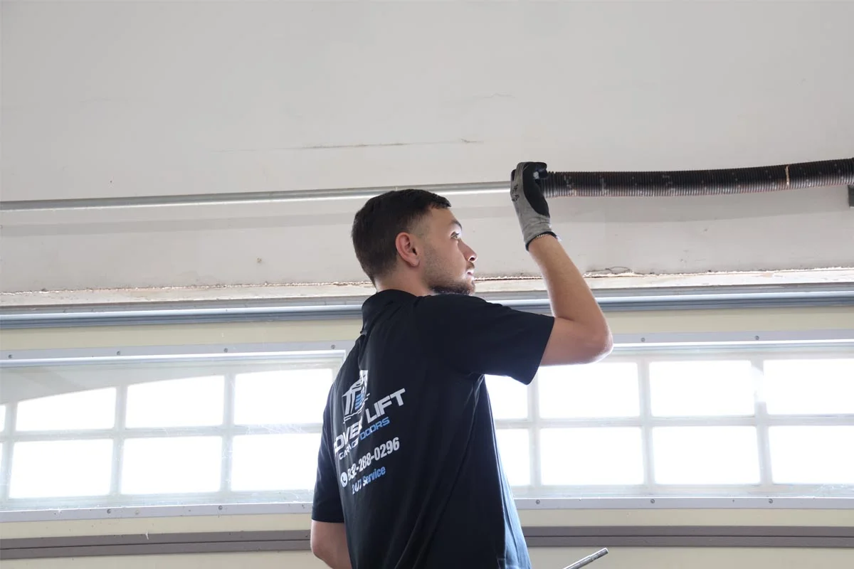 Fixing noisy garage door rollers in Magnolia, TX.